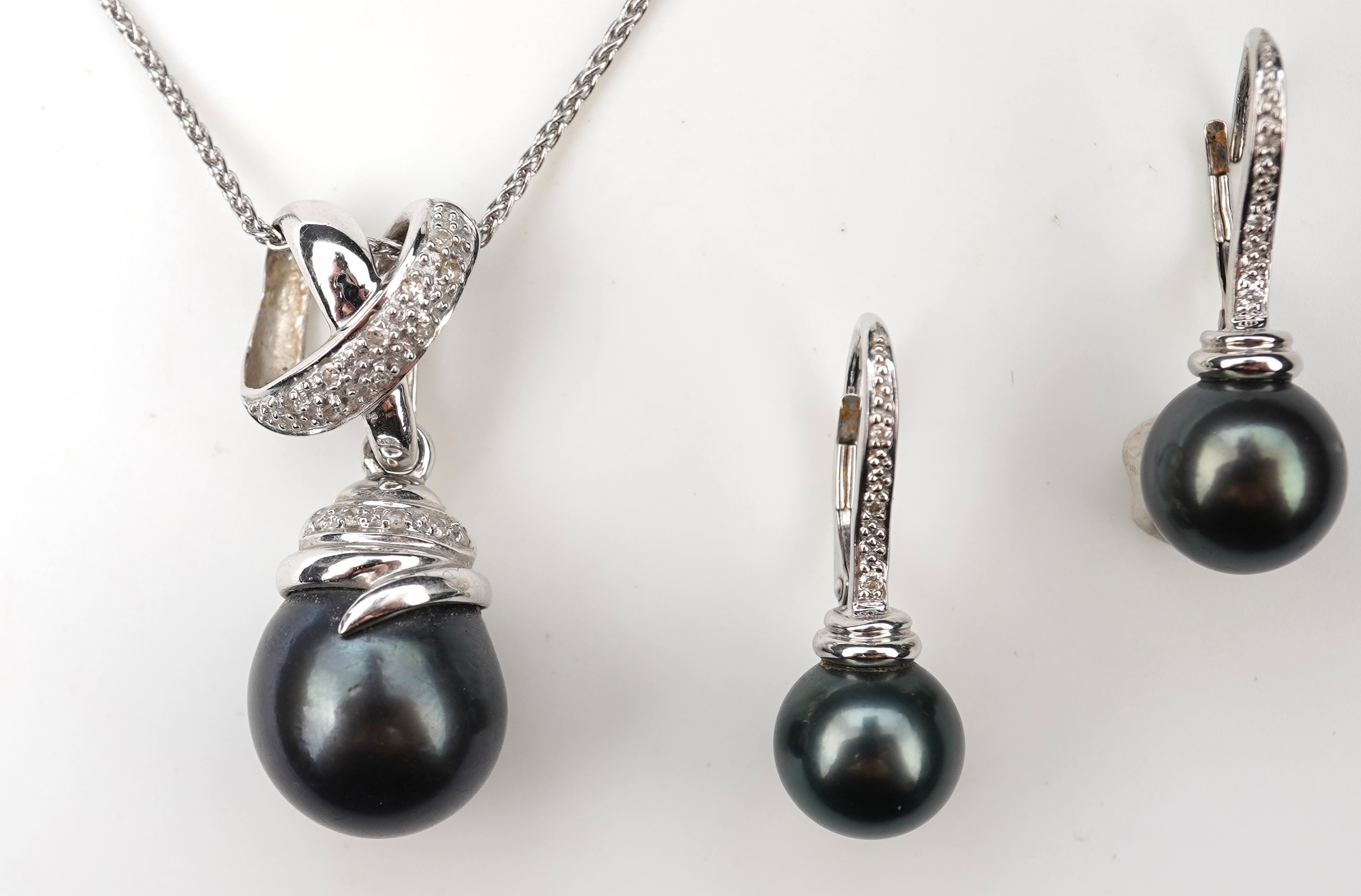 A cultured pearl and diamond demi-parure